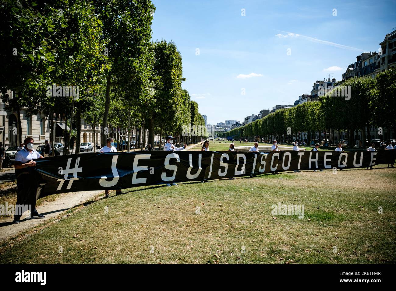 A large banner with the message #jesuisdiscothèque was deployed on July 12, 2020, when nightclub owners expressed their anger on the Place Vauban in Paris, near the Ministry of Health, a few days after the announcement that nightclubs (discos, nightclubs, dance floors etc.) would remain closed until at least the end of September for health reasons following the COVID-19 coronavirus epidemic. (Photo by Samuel Boivin/NurPhoto) Stock Photo