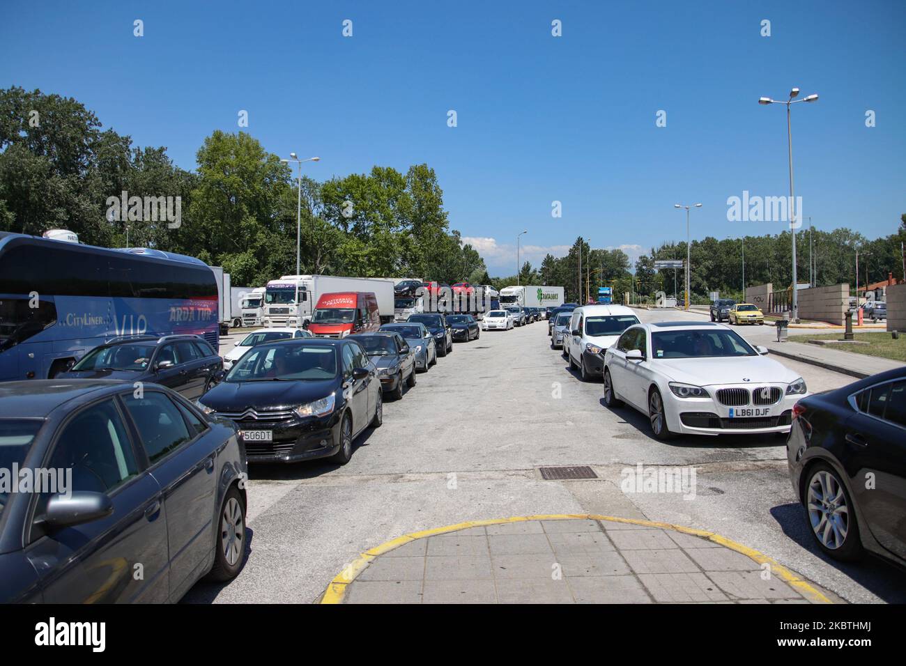 Queues of cars at the border checkpoint where vehicles are sprayed with ...