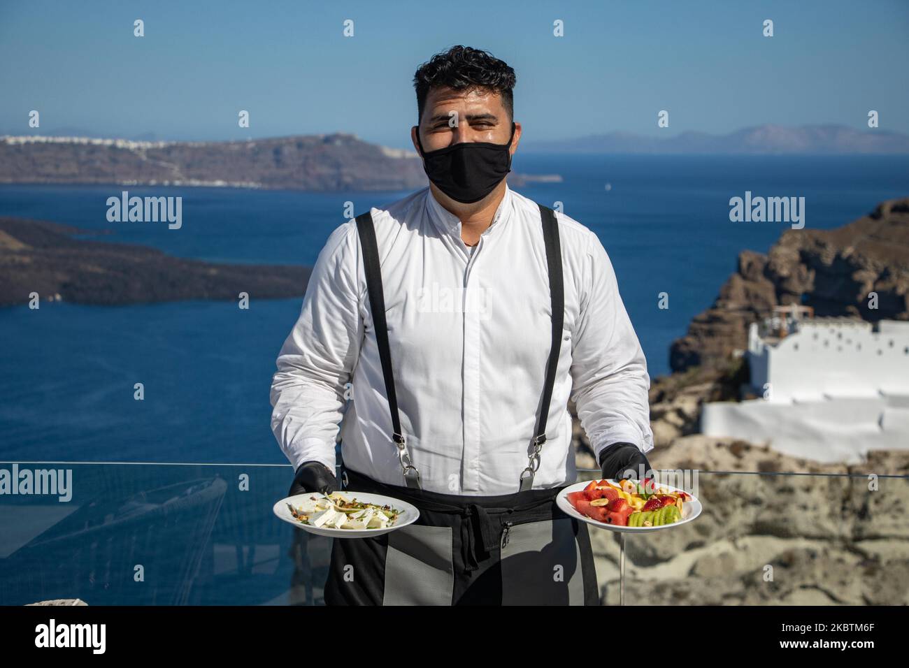Portrait of a waiter serving the a la carte breakfast at the restaurant
