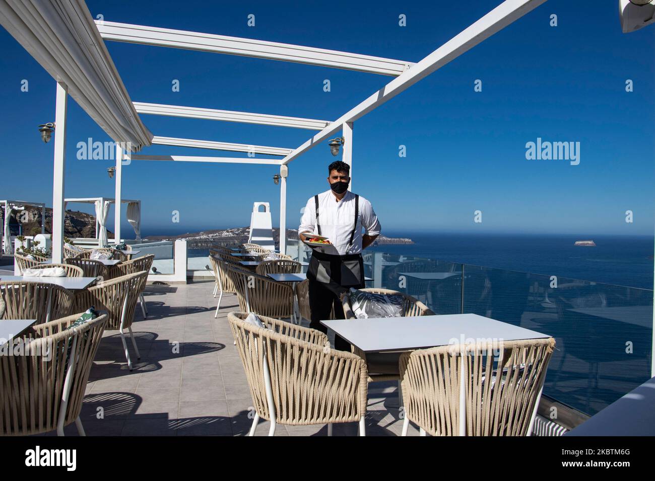 Portrait of a waiter serving the a la carte breakfast at the restaurant