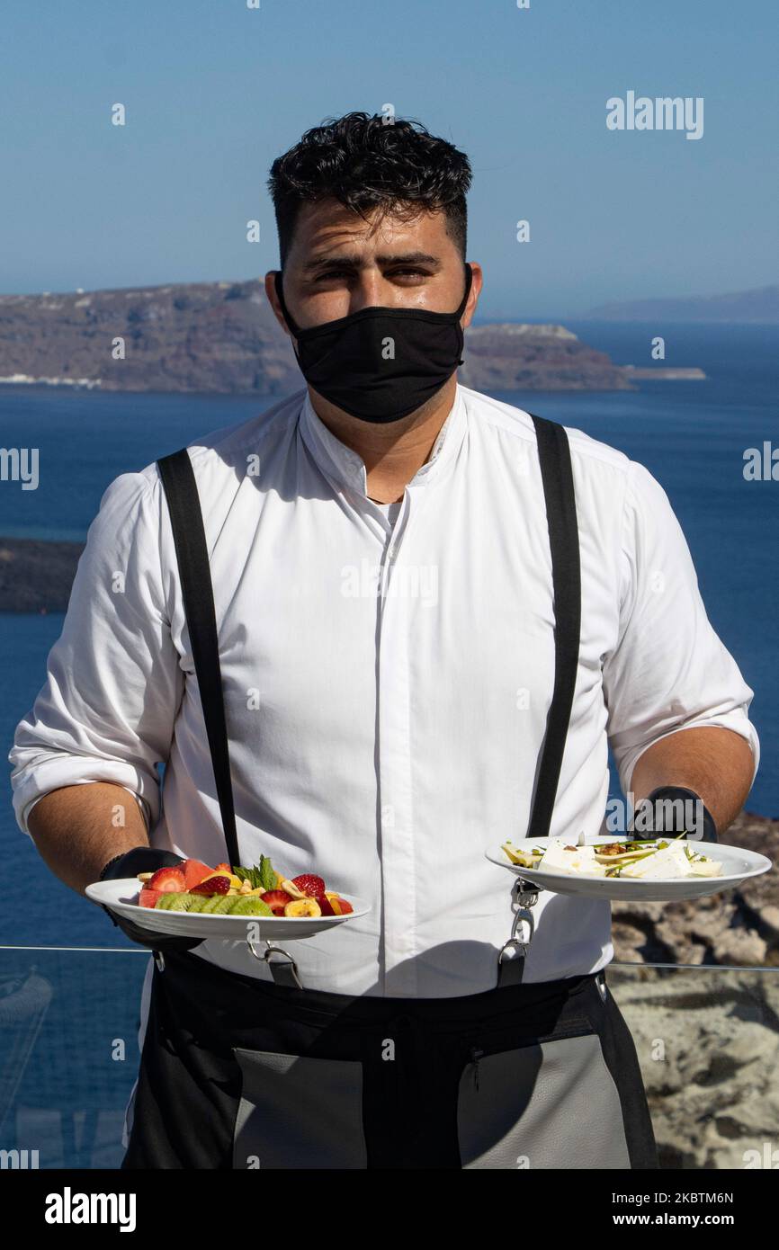 Portrait of a waiter serving the a la carte breakfast at the restaurant