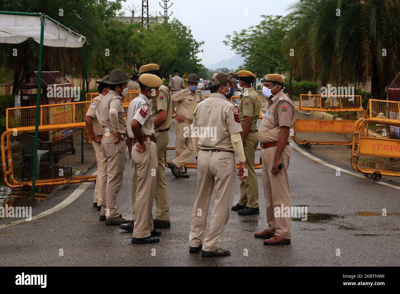 Security personnel stand guard outside a hotel where Congress leaders