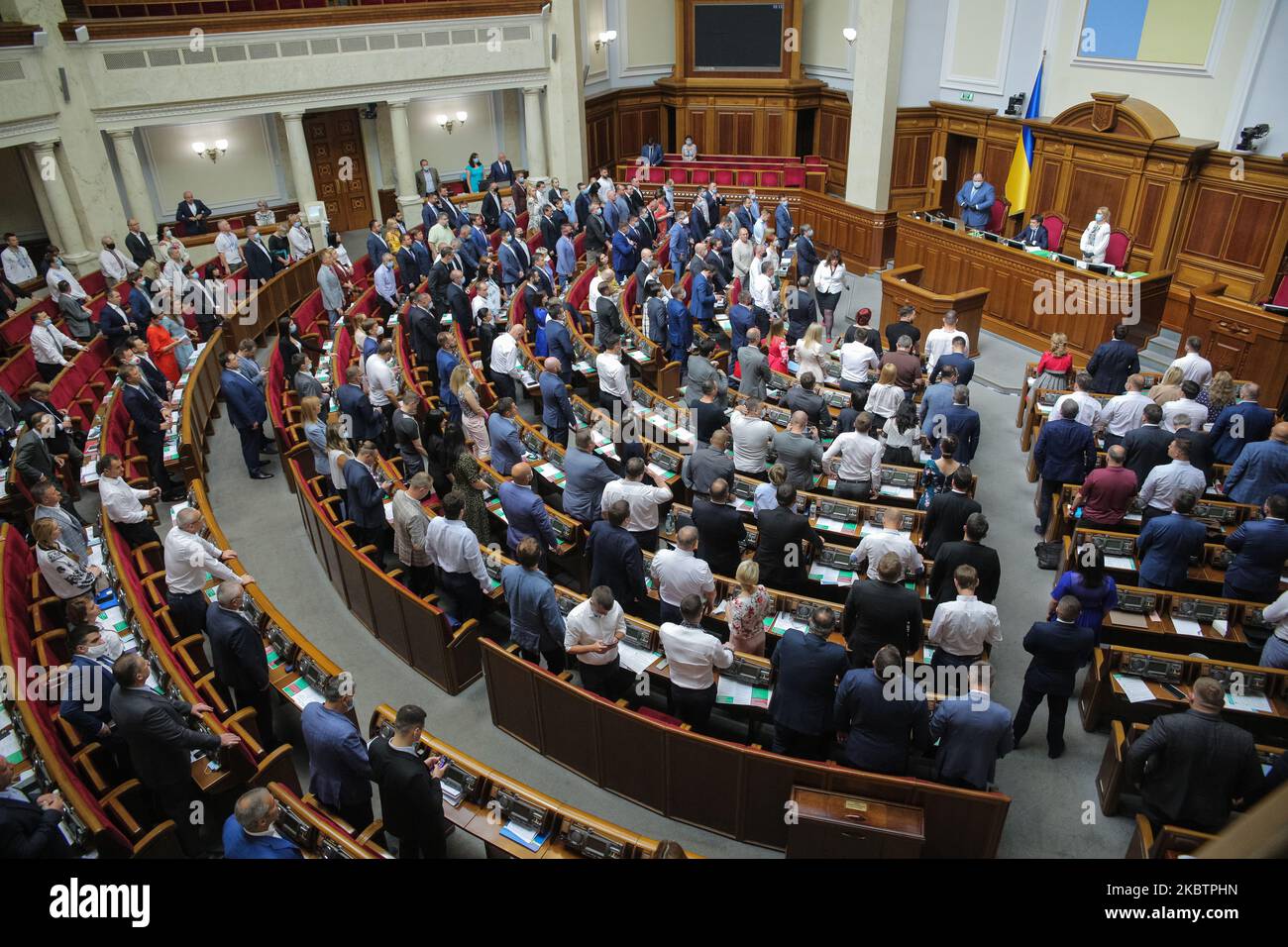 Lawmakers stand during the mourning for killed in war in Kyiv, Ukraine, July 16, 2020. Ukrainian Parliament voted for Heads of Central Bank, Antimonopoly Committee and appointed new Vice minister, Minister for Strategic Industries. (Photo by Sergii Kharchenko/NurPhoto) Stock Photo