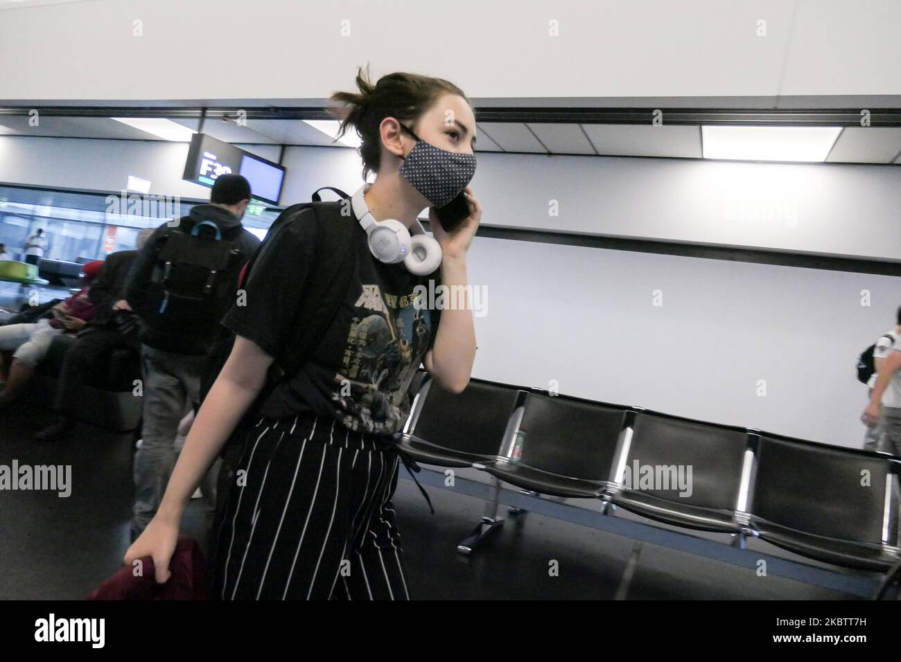 Passengers wearing facemasks, gloves and safety measures are seen on July 15, 2020 at the terminal, F Gates area of Vienna International Airport VIE LOWW - Flughafen Wien-Schwechat serving the Austrian Capital but also Bratislava as it is 55km away from the Slovak city during the Covid-19 Coronavirus pandemic era with social distancing measures and disinfecting hand sanitizer everywhere afther the lockdown period. On July 1, Austria issues travel warning for six Balkan states countries, Serbia, Montenegro, Bosnia Herzegovina, North Macedonia, Albania and Kosovo. Passengers traveling from those Stock Photo