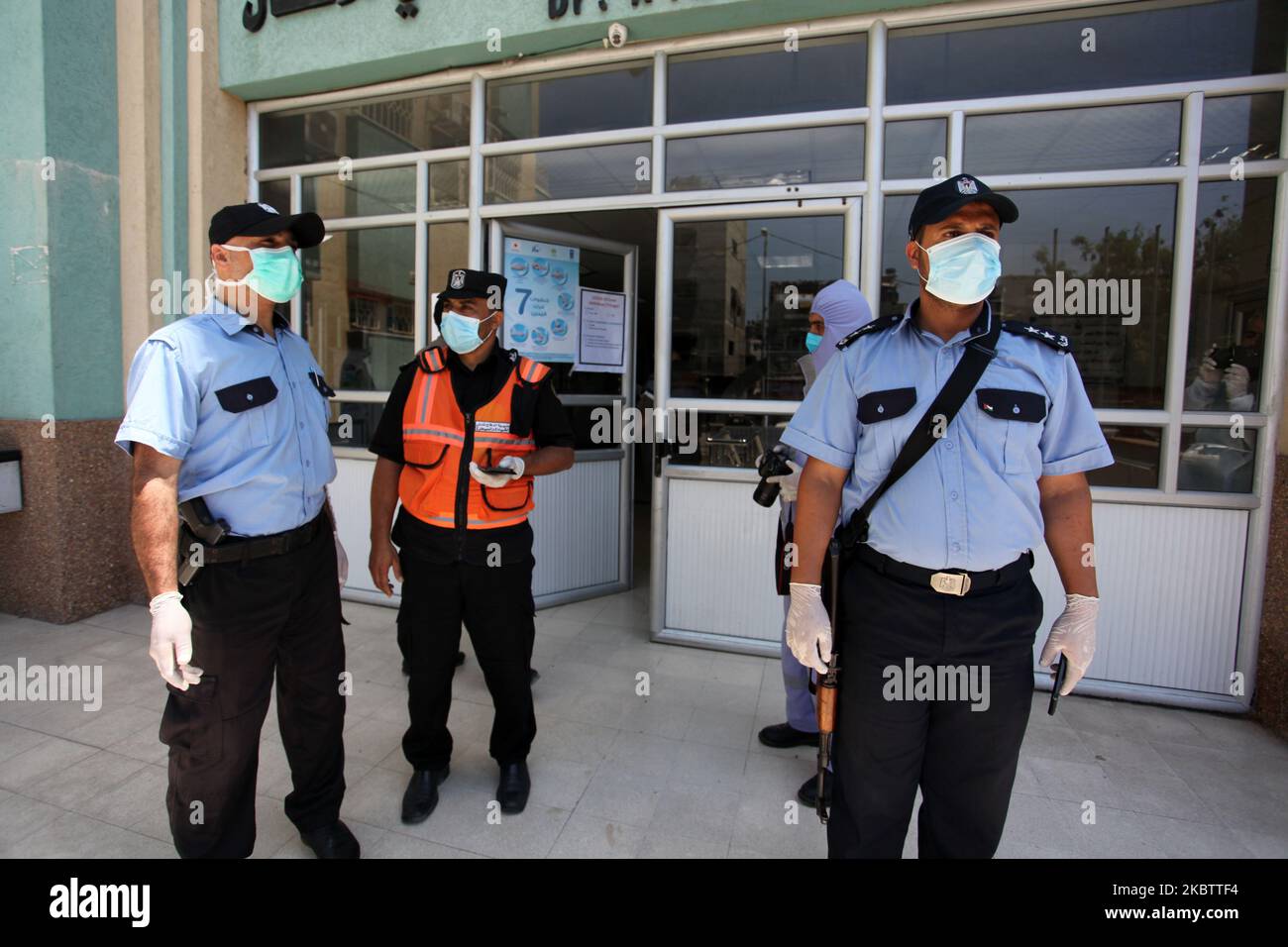 Palestinian staff from the Ministry of Health wear protective gear and Palestinian policemen, take part in a simulation training, against the coronavirus disease (COVID-19), organized by the Ministries of Health and the Interior, at a hospital in Gaza city, on July 18, 2020. (Photo by Majdi Fathi/NurPhoto) Stock Photo