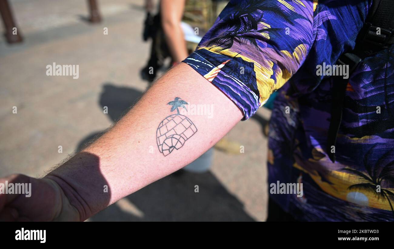A 'Boogaloo Boy' shows his 'big igloo' tattoo, which is slang for 'the