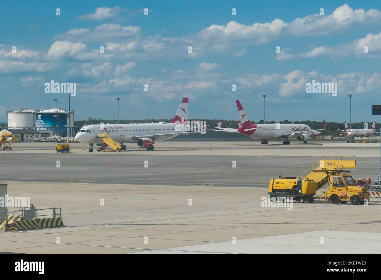 The grounded fleet of Austrian Airlines OS AUA, the flag carrier of Austria subsidiary of Lufthansa Group and member of Star Alliance as seen in Vienna International Airport Schwechat VIE, Austria, on July 15, 2020. Boeing and Airbus aircraft with the engines covered are seen parked on the apron tarmac during the Coronavirus Covid-19 Pandemic era as air travel traffic was reduced because of travel restrictions and traveling ban or lockdown quarantine measures. On July 1, Austria issues travel warning for six Balkan states countries, Serbia, Montenegro, Bosnia Herzegovina, North Macedonia, Alba Stock Photo