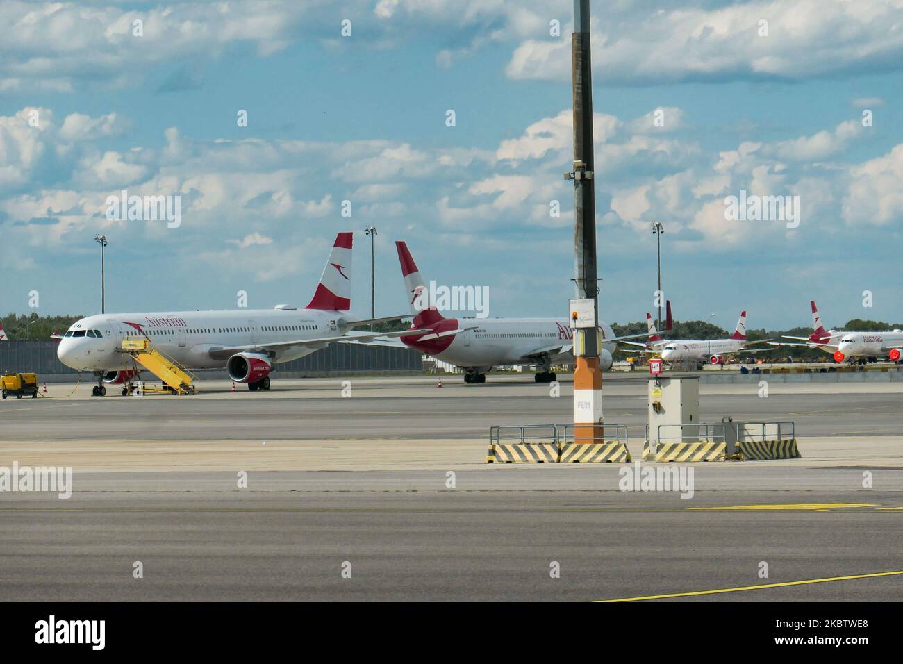 The grounded fleet of Austrian Airlines OS AUA, the flag carrier of Austria subsidiary of Lufthansa Group and member of Star Alliance as seen in Vienna International Airport Schwechat VIE, Austria, on July 15, 2020. Boeing and Airbus aircraft with the engines covered are seen parked on the apron tarmac during the Coronavirus Covid-19 Pandemic era as air travel traffic was reduced because of travel restrictions and traveling ban or lockdown quarantine measures. On July 1, Austria issues travel warning for six Balkan states countries, Serbia, Montenegro, Bosnia Herzegovina, North Macedonia, Alba Stock Photo