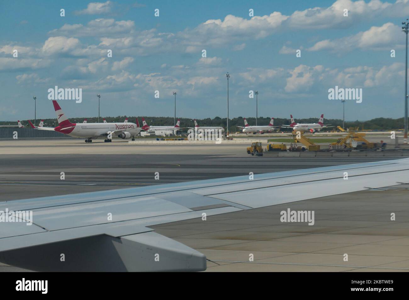 The grounded fleet of Austrian Airlines OS AUA, the flag carrier of Austria subsidiary of Lufthansa Group and member of Star Alliance as seen in Vienna International Airport Schwechat VIE, Austria, on July 15, 2020. Boeing and Airbus aircraft with the engines covered are seen parked on the apron tarmac during the Coronavirus Covid-19 Pandemic era as air travel traffic was reduced because of travel restrictions and traveling ban or lockdown quarantine measures. On July 1, Austria issues travel warning for six Balkan states countries, Serbia, Montenegro, Bosnia Herzegovina, North Macedonia, Alba Stock Photo