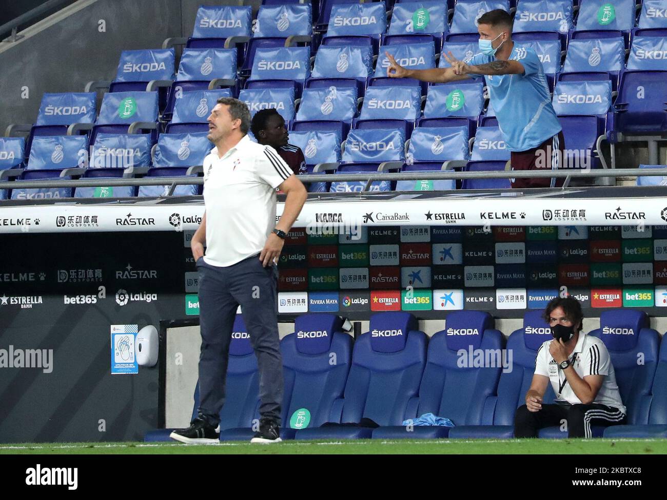 Oscar Garcia and a substitute player pointing fingers that the Leganes-R.Madrid match goes 2-2 during the match between RCD Espanyol and Real Club Celta de Vigo, corresponding to the week 38 of the Liga Santander, played at the RCDE Stadium, 19th July 2020, in Barcelona, Spain. (Photo by Joan Valls/Urbanandsport /NurPhoto) Stock Photo