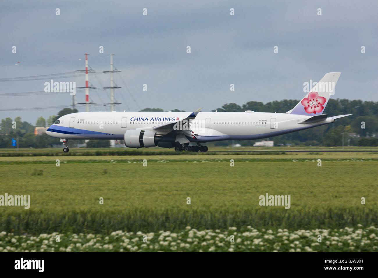 China Airlines Airbus A350-900 aircraft as seen on final approach flying, landing and touching down at Amsterdam Schiphol AMS EHAM International Airport in the Netherlands at Polderbaan runway. The Airbus A350 airplane is a new, modern, advanced, environmentally friendly, fuel-efficient wide-body plane, a long haul airliner is powered by 2x RR Rolls Royce Jet Engines and registration B-18905. The Chinese carrier China Airlines CI CAL DYNASTY is the national carrier of the Republic of China ( Taiwan ), member of SkyTeam aviation alliance, with headquarters in Taipei Taoyuan Airport in Asia. Jul Stock Photo