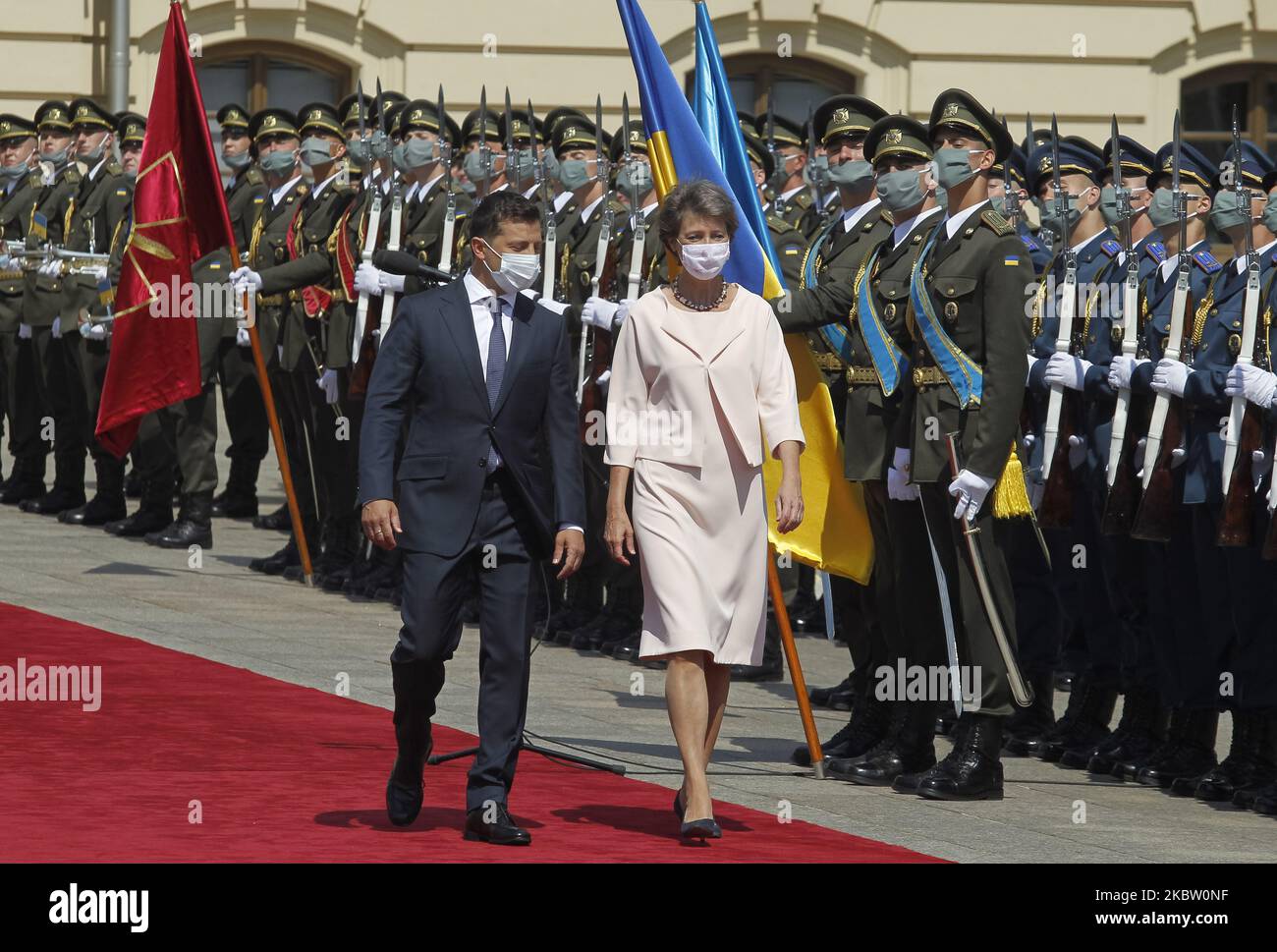 Ukrainian President Volodymyr Zelensky (L) and President of the Swiss Confederation Simonetta Sommaruga (R) review the guard of honor before their meeting at the Mariyinsky Palace in Kiev, Ukraine, on 21 July, 2020. Simonetta Sommaruga is on official visit to Ukraine 20-23 July, during which she plans visit Donbas and meet with top officials and representatives of civil society, as local media reported. (Photo by STR/NurPhoto) Stock Photo