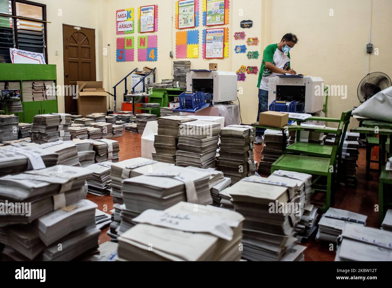 A teacher volunteers to photocopy learning materials to be used by