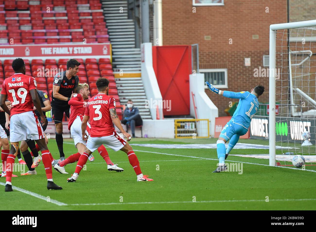 Jordan Smith (12) of Nottingham Forest dives as Danny Batth (6) of Stoke City scores to make it 0-1 during the Sky Bet Championship match between Nottingham Forest and Stoke City at the City Ground, Nottingham. (Photo by Jon Hobley/MI News/NurPhoto) Stock Photo