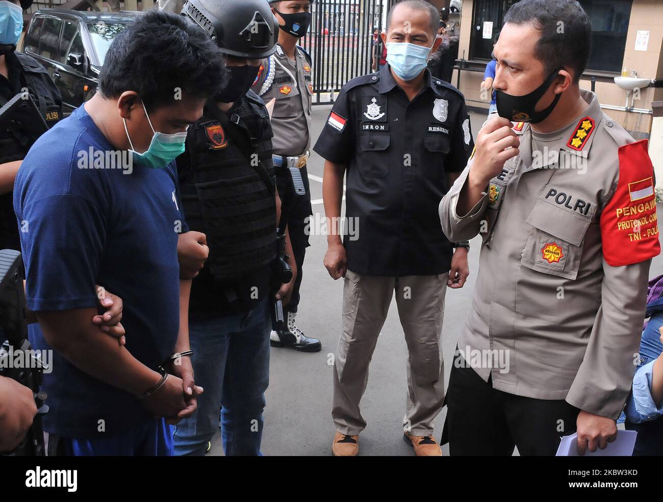 Police arrested a child torturer heading to the East Jakarta Regional Police Office (Polres), Jatinegara, on, July, 23,2020. The arrest was due to a viral video on social media and the victim of a child often gets abusive actions against the perpetrator who is his own father. Dasril Roszandi (Photo by Dasril Roszandi/NurPhoto) Stock Photo