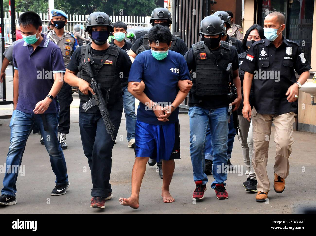 Police arrested a child torturer heading to the East Jakarta Regional Police Office (Polres), Jatinegara, on, July, 23,2020. The arrest was due to a viral video on social media and the victim of a child often gets abusive actions against the perpetrator who is his own father. Dasril Roszandi (Photo by Dasril Roszandi/NurPhoto) Stock Photo