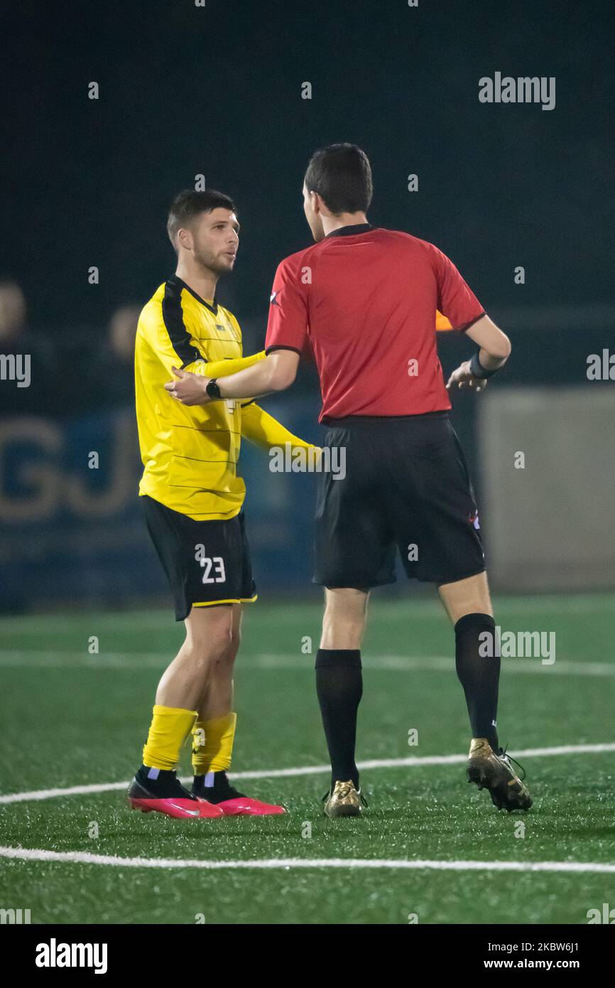 Game referee speaks to Micheal Konestabo of the NWS Spirit FC during