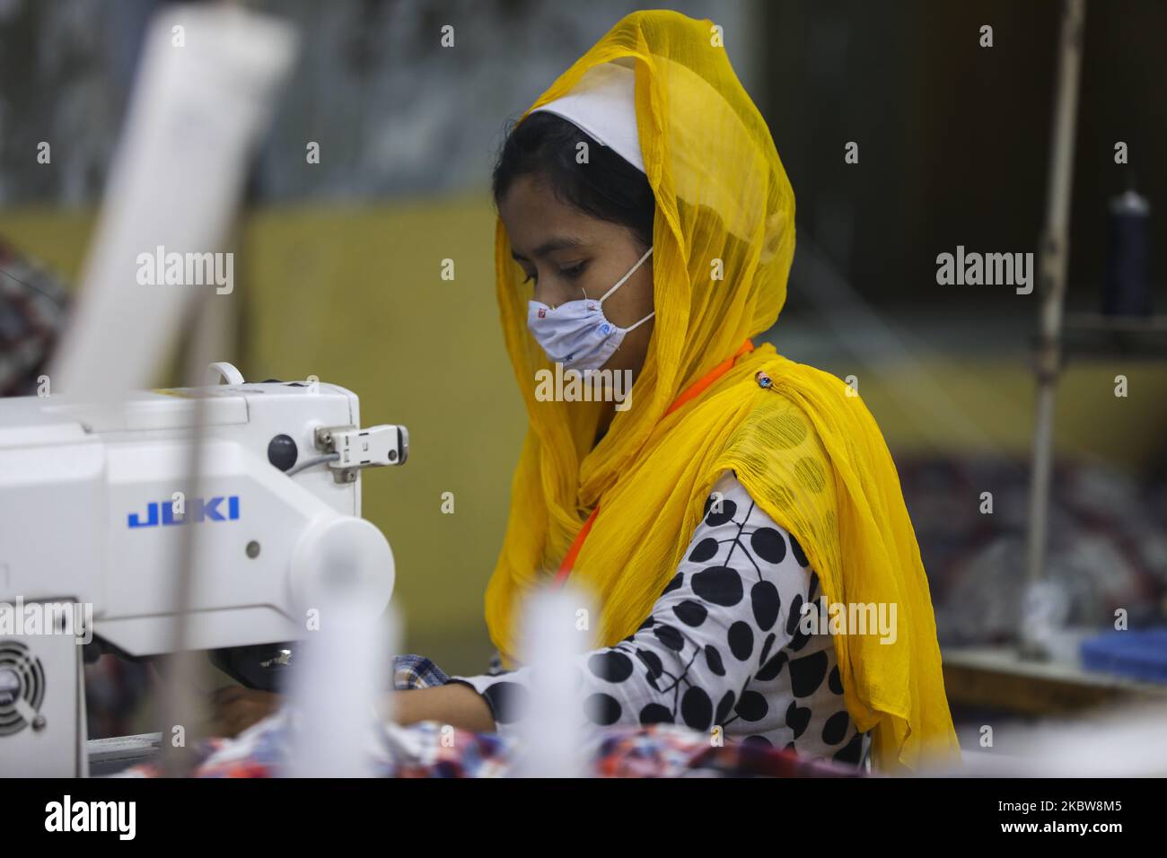 Ready made garments worker works in a garments factory in Dhaka on July