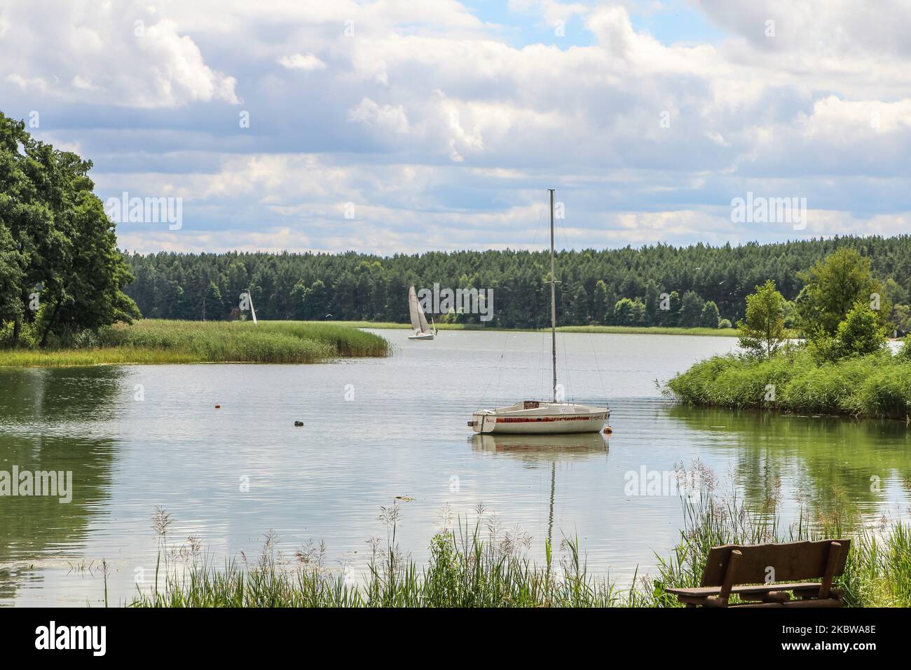 General view of the Jelenie lake is seen in Wdzydze Kiszewskie, Poland on 25 July 2020 Due to the coronavirus pandemic, the vast majority of Poles spend their holidays in their own country. The Baltic Sea, Kashubia, Masuria and the mountains are popular. People spend their holidays in motorhomes, caravans and rented holiday homes. (Photo by Michal Fludra/NurPhoto) Stock Photo