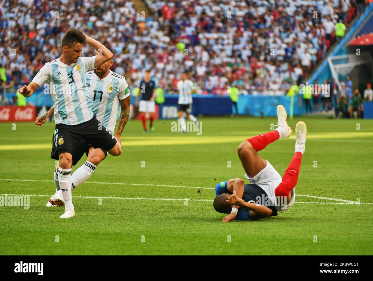 Kylian Mbappe of France and Nicolas Tagliafico of Argentina and Marcos Rojo of Argentina during the FIFA World Cup match France versus Argentina at Kazan Arena, Kazan, Russia on June 30, 2018. (Photo by Ulrik Pedersen/NurPhoto) Stock Photo
