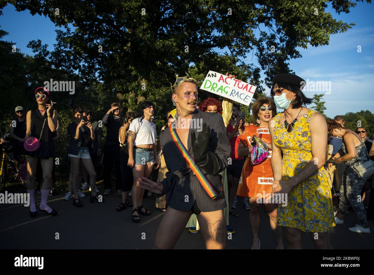 Race winner reacts after receiving a price during an event under the name 'Actual Drag Race' consisting in a race and performances at Hasenhaide Park in Berlin on July 28, 2020. Also drags have been suffering under economic problems and lacking work due to the restrictions to prevent the spread of coronavirus and called with the event to support with donations and solidarity in the gay community. (Photo by Emmanuele Contini/NurPhoto) Stock Photo