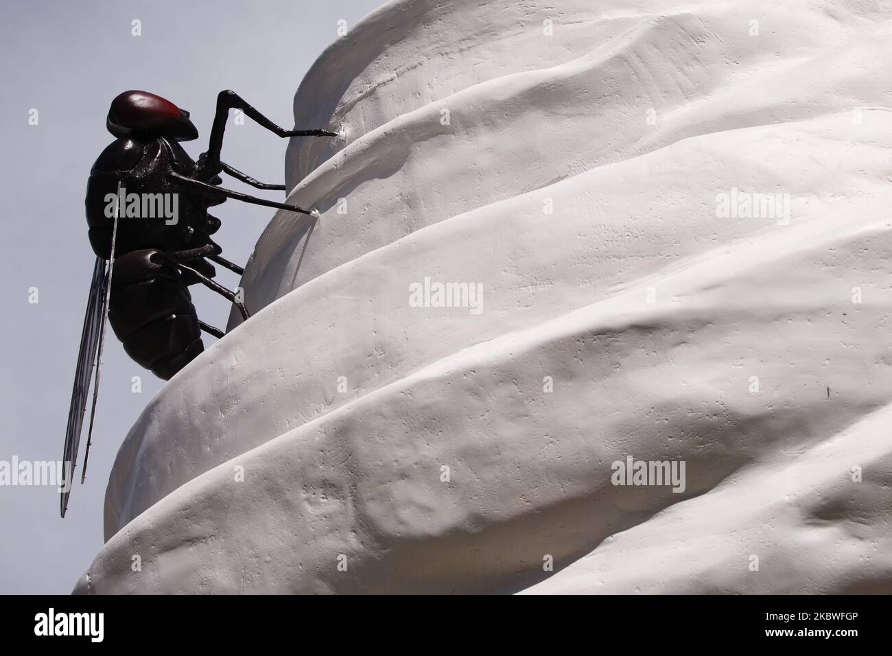 Detail of 'THE END', by British artist Heather Phillipson, on the Fourth Plinth in Trafalgar Square in London, England, on July 30, 2020. The installation, unveiled today, has seen its debut delayed from March due to the coronavirus pandemic. Its depiction of a cherry-topped swirl of cream, plus a drone and fly, is described by its accompanying explanatory note as a 'monument to hubris and impending collapse'. The piece is the 13th commission to occupy the plinth and will remain in place until 2022. (Photo by David Cliff/NurPhoto) Stock Photo