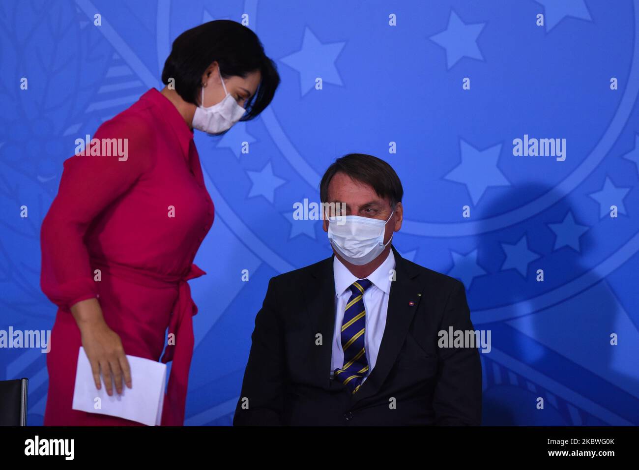 Brazil's president Jair Bolsonaro next to first lady Michelle Bolsonaro attends the launching ceremony of a campaign to support rural women at Palace in Brasilia, Brazil, on Wednesday, July 29, 2020. Brazil's government announced on July 30 that first lady Michele Bolsonaro tested positive for Coronavirus (COVID-19). (Photo by Andre Borges/NurPhoto) Stock Photo