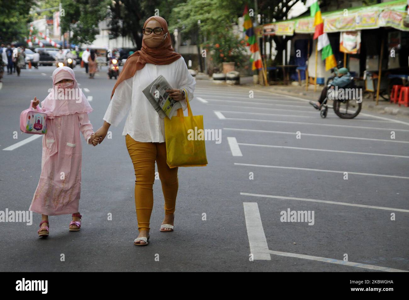 Azhar Mask Indonesian muslims wearing protective face mask as one of the new ...