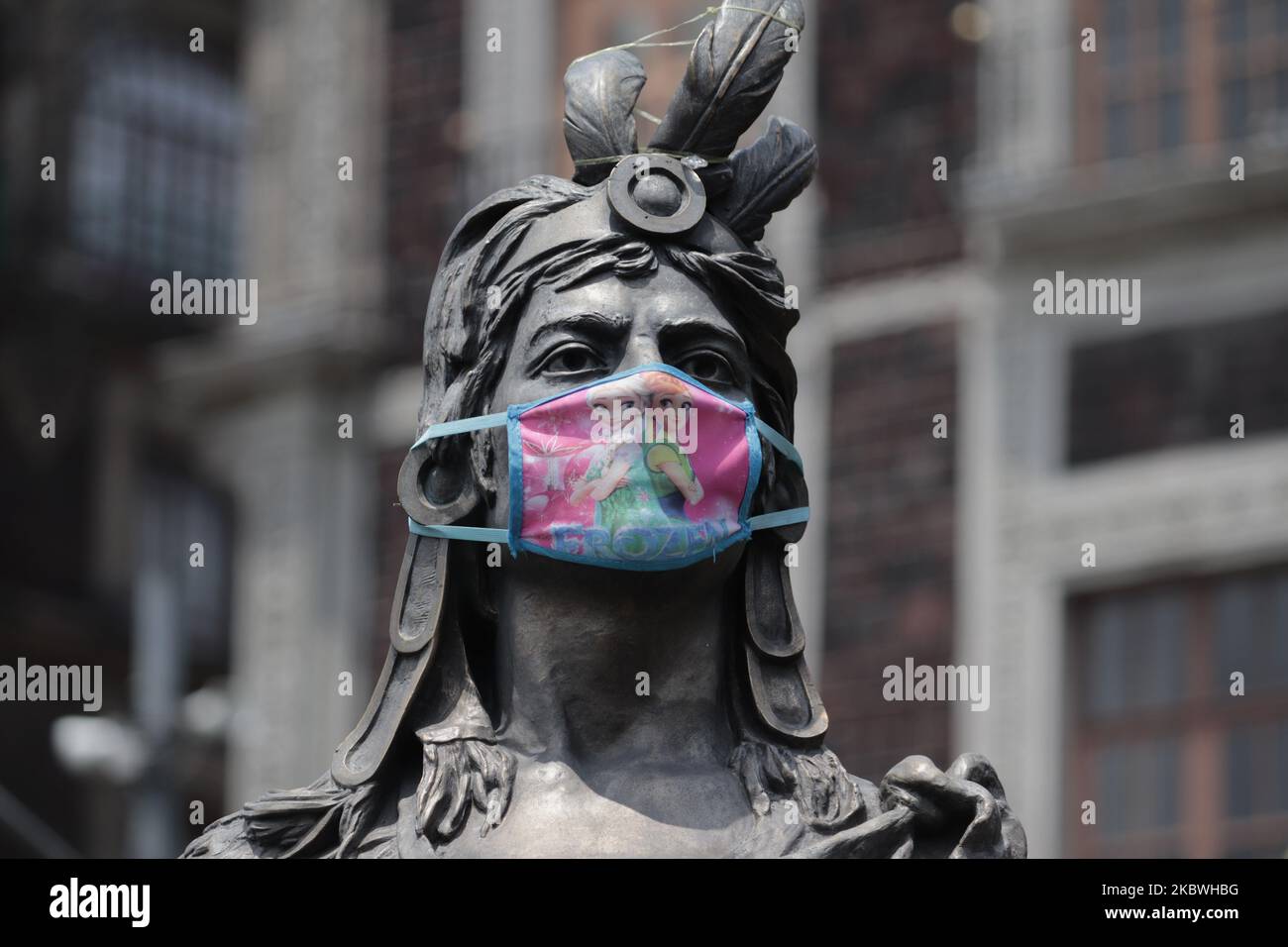 Bust of the last Aztec emperor with face masks in the Zocalo of Mexico City, Mexico on July 31, 2020 during the march of feminist groups from their windows that went to that place to demand the decriminalization of abortion in Veracruz. (Photo by Gerardo Vieyra/NurPhoto) Stock Photo