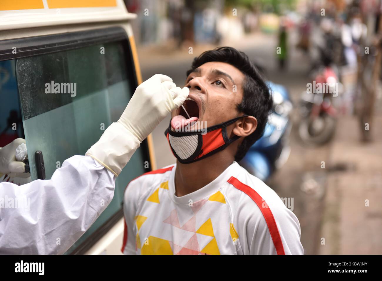 A medical staff collects swab from a boy for COVID 19 testing in Kolkata, India, on August 2, 2020. (Photo by Sukhomoy Sen/NurPhoto Stock Photo - Alamy A medical staff collects swab from a boy for COVID 19 testing in Kolkata, India, on August 2, 2020. (Photo by Sukhomoy Sen/NurPhoto Stock Photo - Alamy