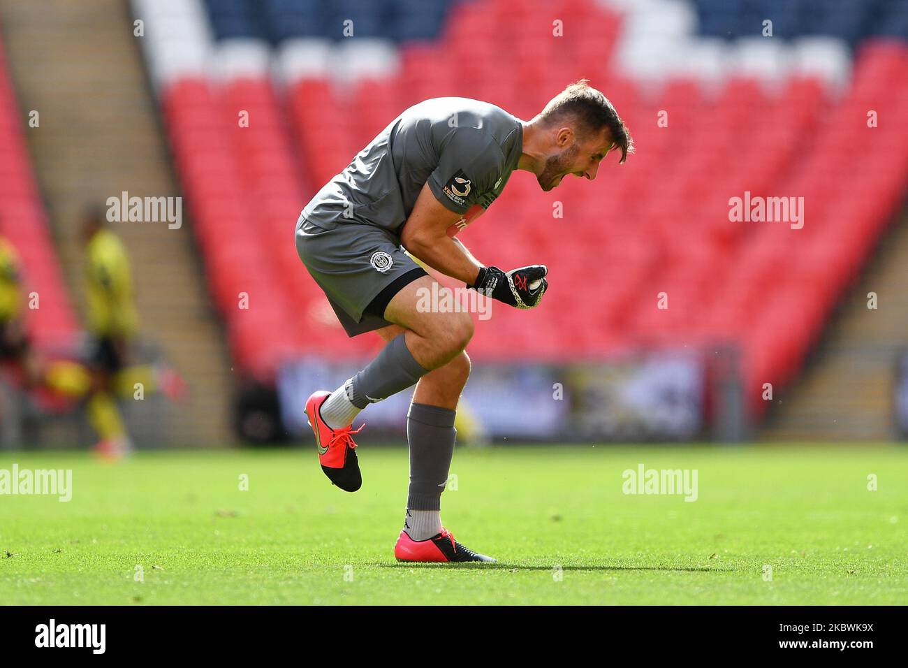 James Belshaw (1) of Harrogate Town celebrates as his side score to make it 2-0 during the Vanarama National League Playoff Final between Notts County and Harrogate Town at Wembley Stadium, London, UK, on August 2, 2020. (Photo by Jon Hobley/MI News/NurPhoto) Stock Photo