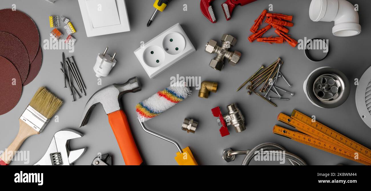 household hardware store tools and items on gray background. home