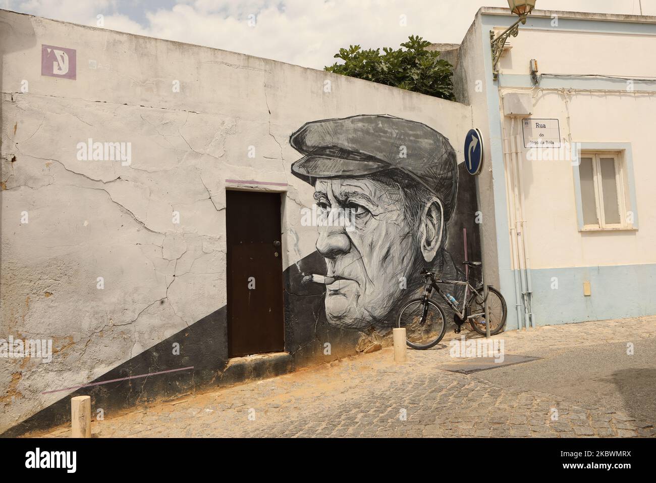 The smoking man mural, Lagos, Algarve, Portugal Stock Photo