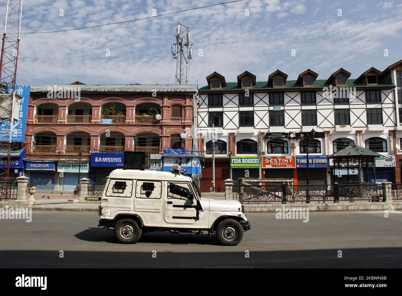 A man walks on a deserted street during strict restrictions in Srinagar, Indian Administered Kashmir on 04 August 2020. Two days curfew has been put in place by authorities on a year anniversary of abrogation of Article 370 which gave special status to the people of Kashmir, curefew was placed on 04th and 5th August citing possibility of the protests in the valley. (Photo by Muzamil Mattoo/NurPhoto) Stock Photo