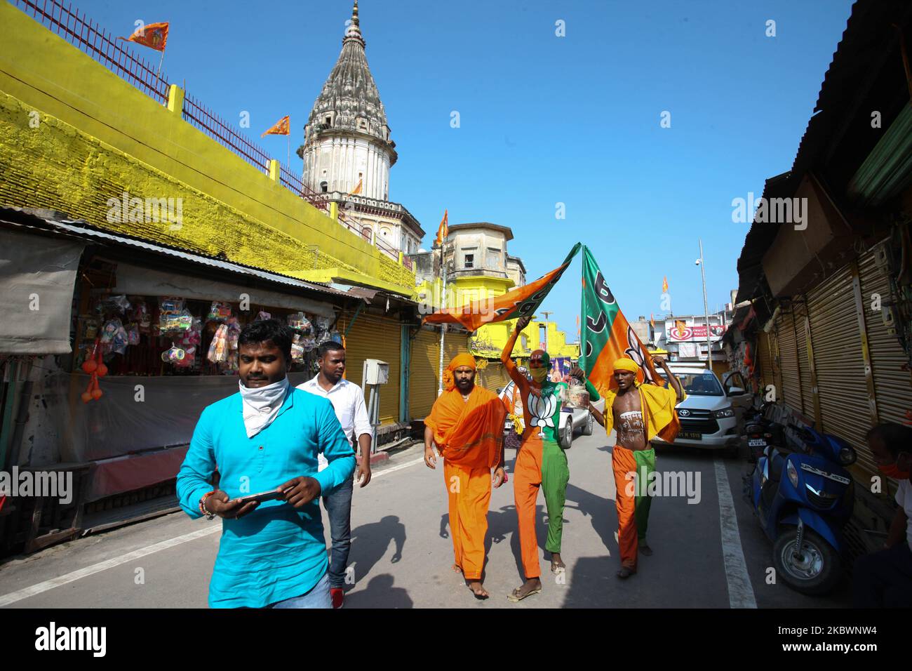 Bhartiya Janta Party supporters walk past near Hanuman Garhi Temple ...