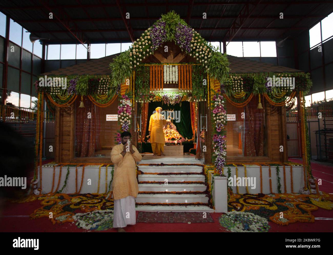 A priest offers evening prayers of Hindu Lord Ram , brother Laxman , Bharat and shatrughan inside the temporary premisis Ram temple in Ayodhya, India on August 5,2020. Prime Minister Naendra Modi today takes part in Ground breaking ceremony for the proposed Ram Mandir temple in Ayodhya. (Photo by Ritesh Shukla/NurPhoto) Stock Photo