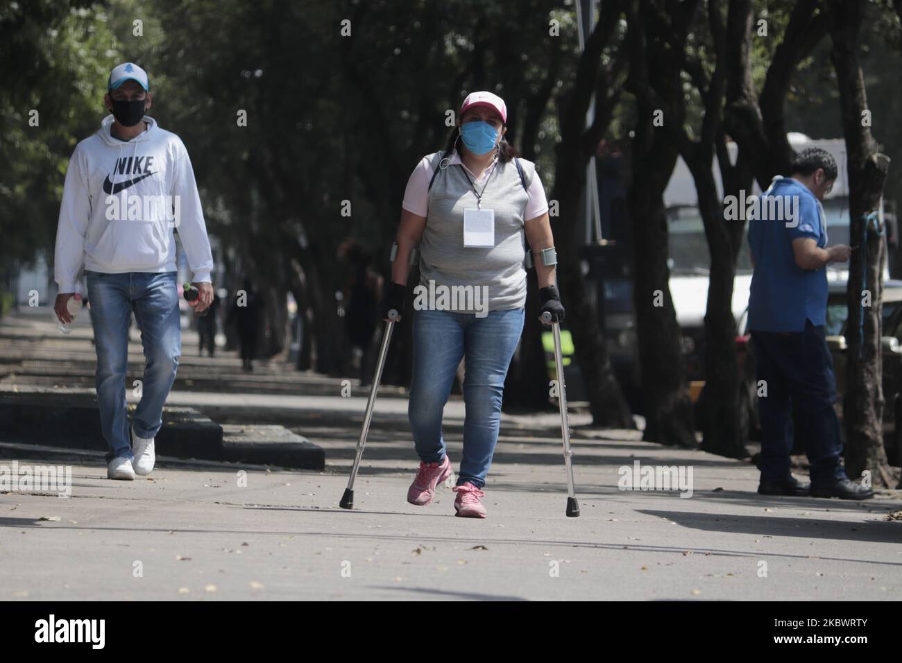 A person with a disability goes to the Venados Hospital in Mexico City during a health emergency, an orange traffic light due to COVID-19 and an epidemiological alert of returning to red due to an increase in coronavirus cases in the capital. (Photo by Gerardo Vieyra/NurPhoto) Stock Photo