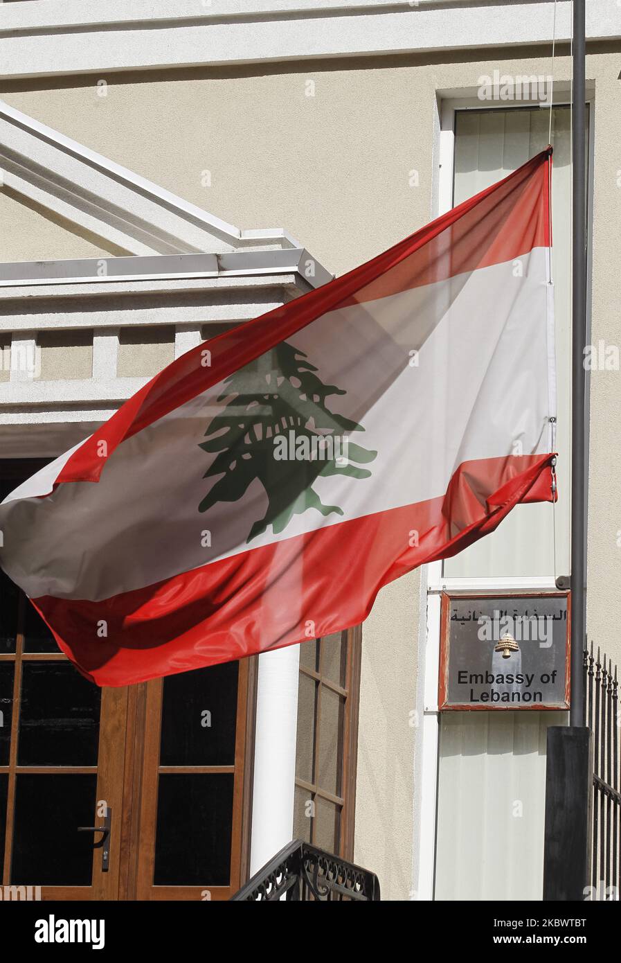 National flag of Lebanon is seen at half-mast in tribute of the victims of the blast in Beirut, on the Embassy of Lebanon in Kyiv, Ukraine, on 06 August, 2020. The massive explosion rocked the Lebanon capital Beirut on 04 August 2020, as a result killed at least 135 people and thousands injured, as media reported. (Photo by STR/NurPhoto) Stock Photo