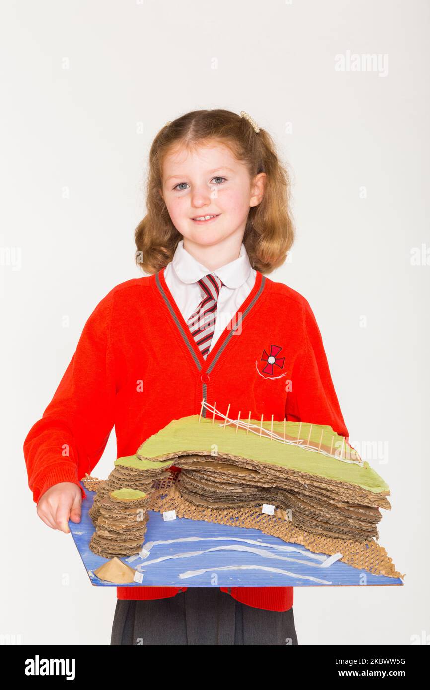 Eight year old schoolgirl in Year 4 at her girl school, pictured with her science project on rising sea level and coastal erosion, which she created in an art class and at home.  (132) Stock Photo