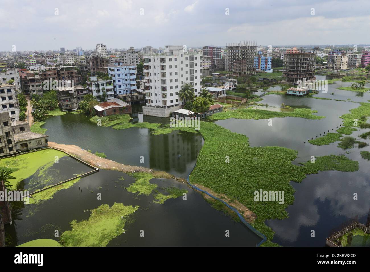 Houses are seen surrounded by the flood water at Lowland area of the Dhaka City in Bangladesh, on August 8, 2020 (Photo by Mamunur Rashid/NurPhoto) Stock Photo