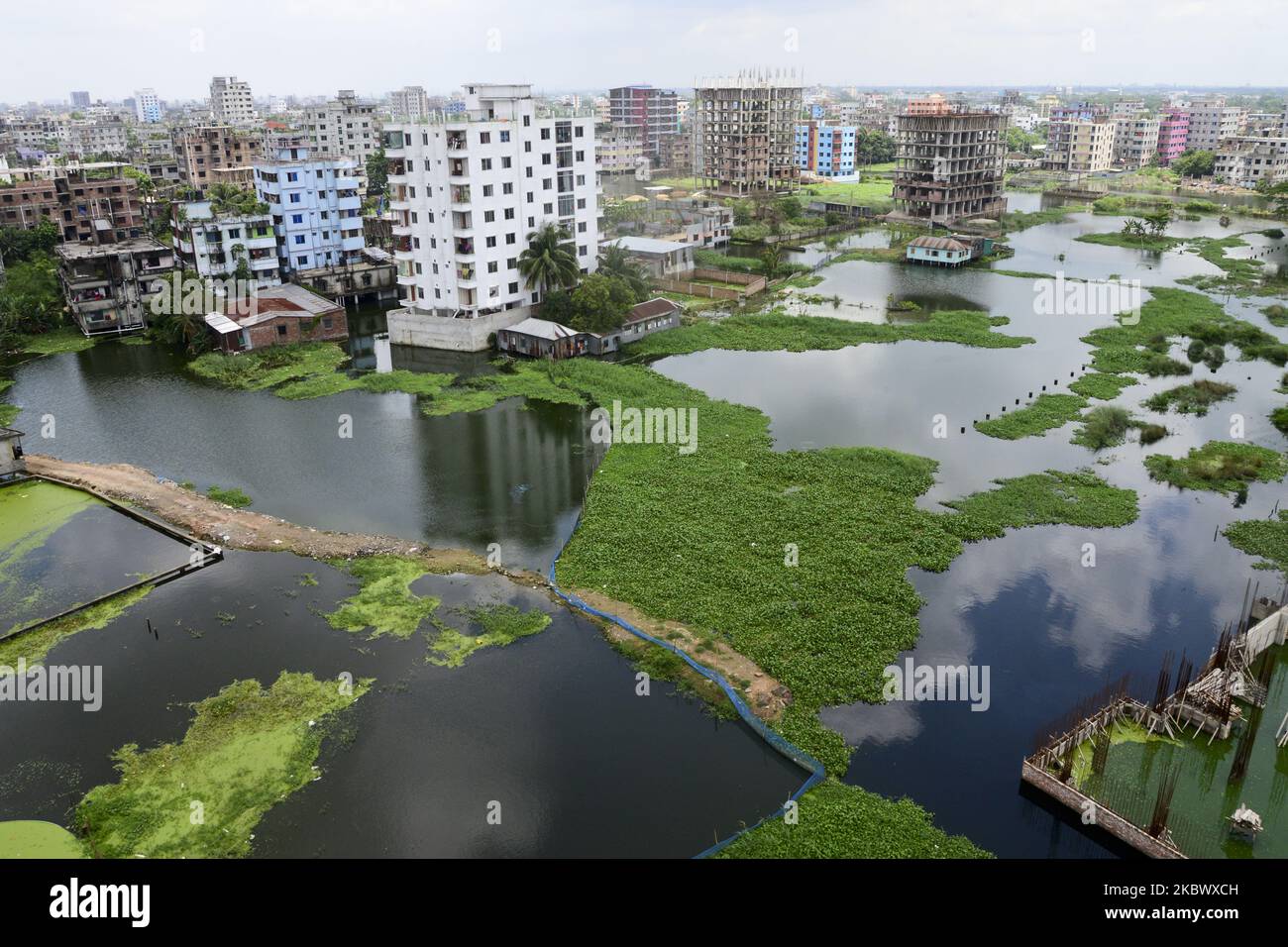 Houses are seen surrounded by the flood water at Lowland area of the Dhaka City in Bangladesh, on August 8, 2020 (Photo by Mamunur Rashid/NurPhoto) Stock Photo