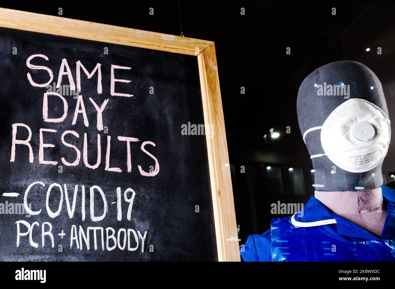 A chalk board advertising covid19 PCR antigen and antibody testing and