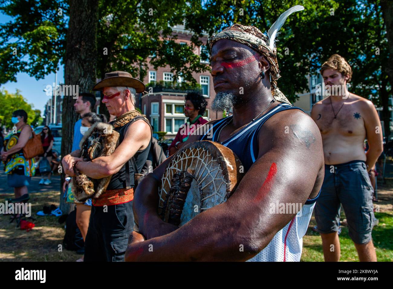 A Black man is holding a minute in silence, during the Demonstration in
