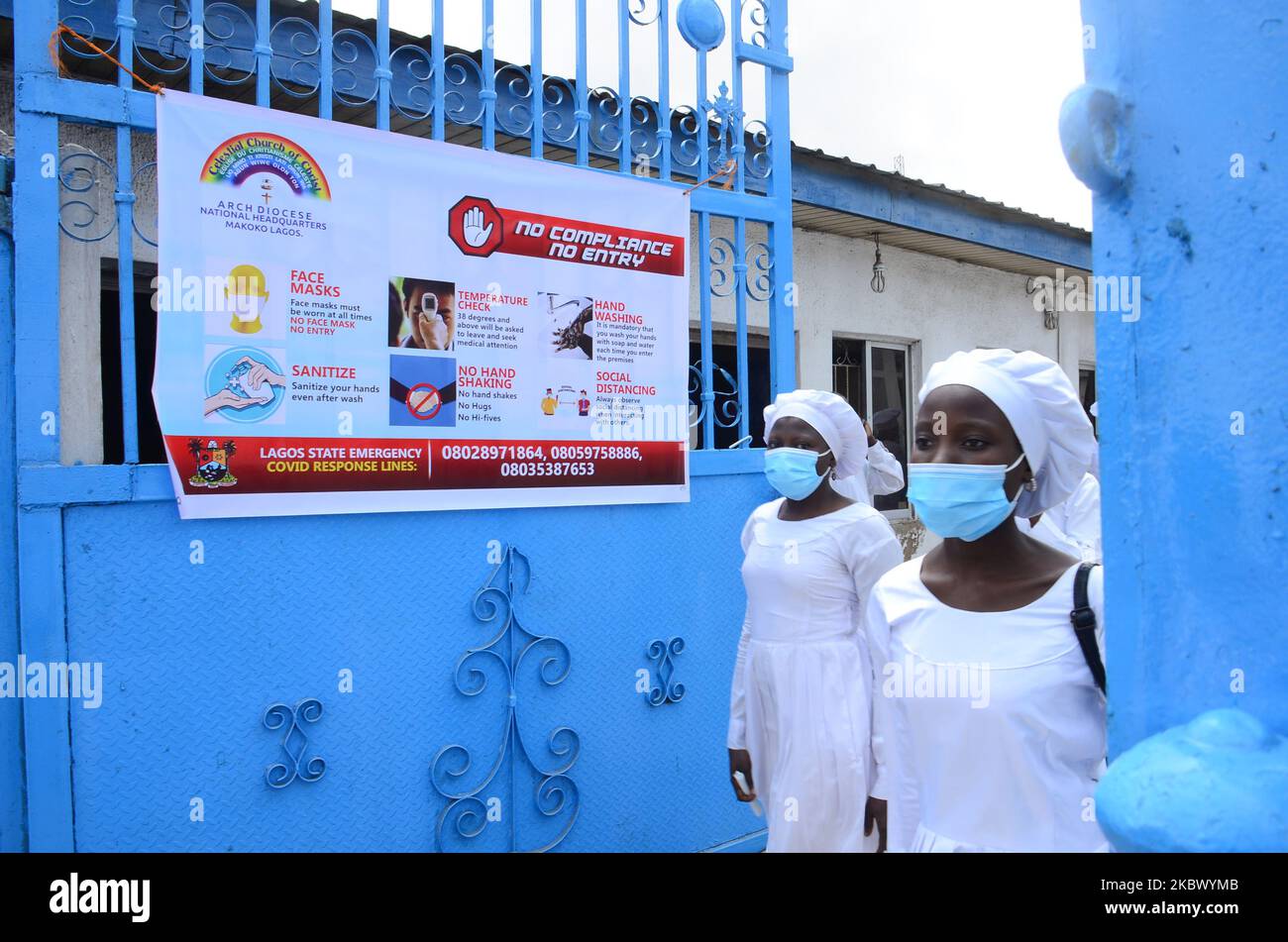 Worshippers leaving the church as worship centers reopen after the COVID-19 lockdown, at the Celestial Church of Christ, Arch Diocese National Headquarter Makoko, Lagos, as measures against the spread of COVID-19 Coronavirus in Lagos, Nigeria on August 8, 2020. (Photo by Olukayode Jaiyeola/NurPhoto) Stock Photo