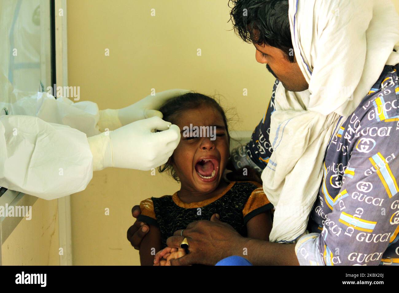 A medical staff collects a sample from a child for Rapid Antigen Test (RAT) for the COVID-19 coronavirus at Chacha Nehru Bal Chikitsalaya near Geeta Colony in New Delhi on August 11, 2020. For the past seven days, India's single-day count of Covid-19 cases has been more than that of the US and Brazil, the two worst-hit nations in terms of infections, according to an analysis of WHO data. India, the third worst-hit nation in terms of infections, has also accounted for over 23 per cent of the cases and more than 15 per cent of the deaths reported Stock Photo