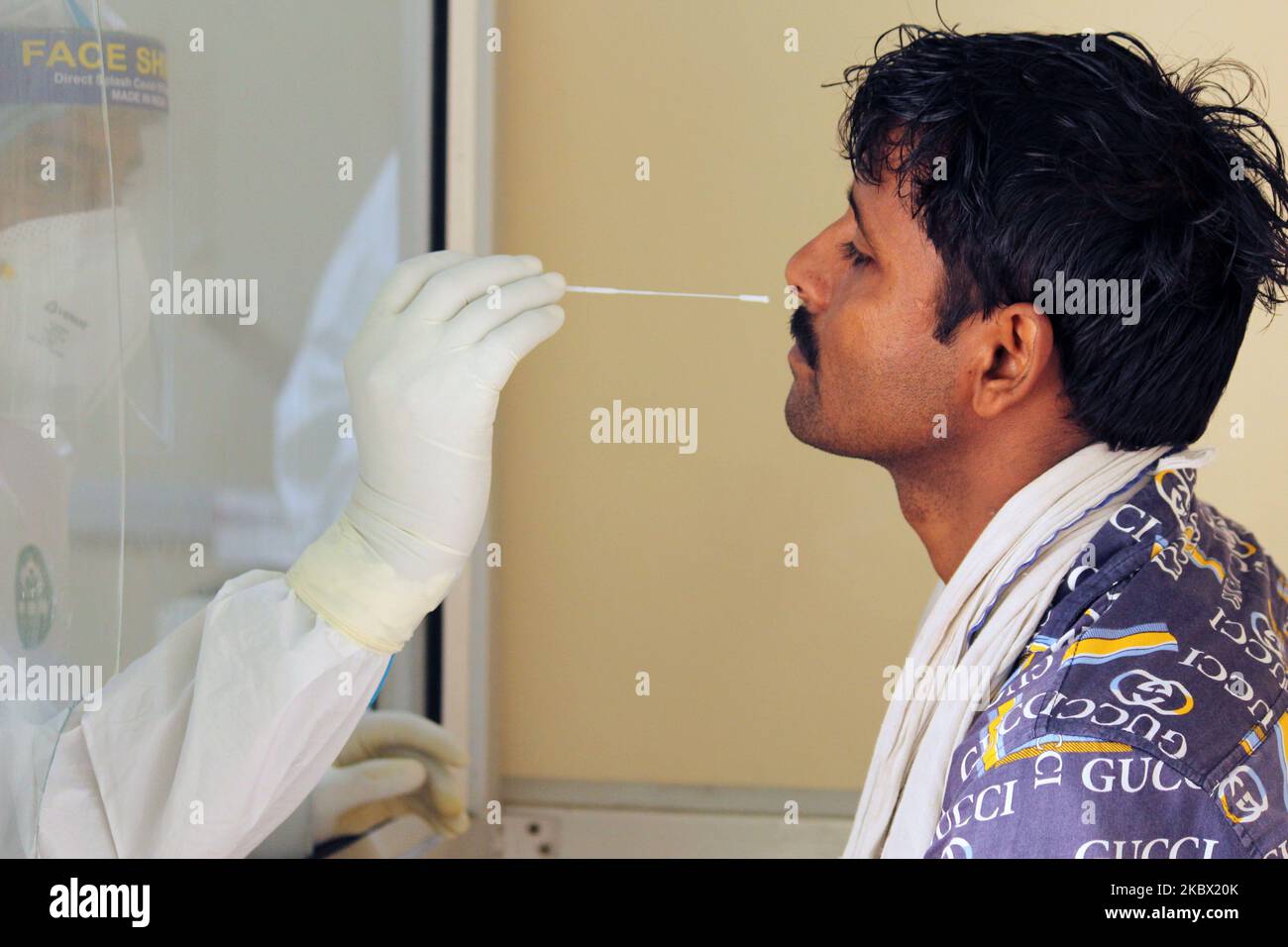 A medical staff collects a sample from a child for Rapid Antigen Test (RAT) for the COVID-19 coronavirus at Chacha Nehru Bal Chikitsalaya near Geeta Colony in New Delhi on August 11, 2020. For the past seven days, India's single-day count of Covid-19 cases has been more than that of the US and Brazil, the two worst-hit nations in terms of infections, according to an analysis of WHO data. India, the third worst-hit nation in terms of infections, has also accounted for over 23 per cent of the cases and more than 15 per cent of the deaths reported Stock Photo