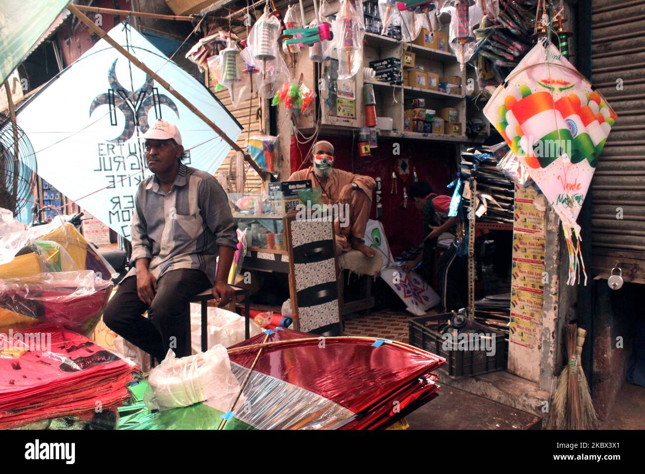 Kite vendors with face mask as a precautionary measure against Covid-19, sell kites in colour of national tri-colour ahead of Independence Day celebrations at Lal Kuan on August 12, 2020 in Delhi, India. (Photo by Mayank Makhija/NurPhoto) Stock Photo