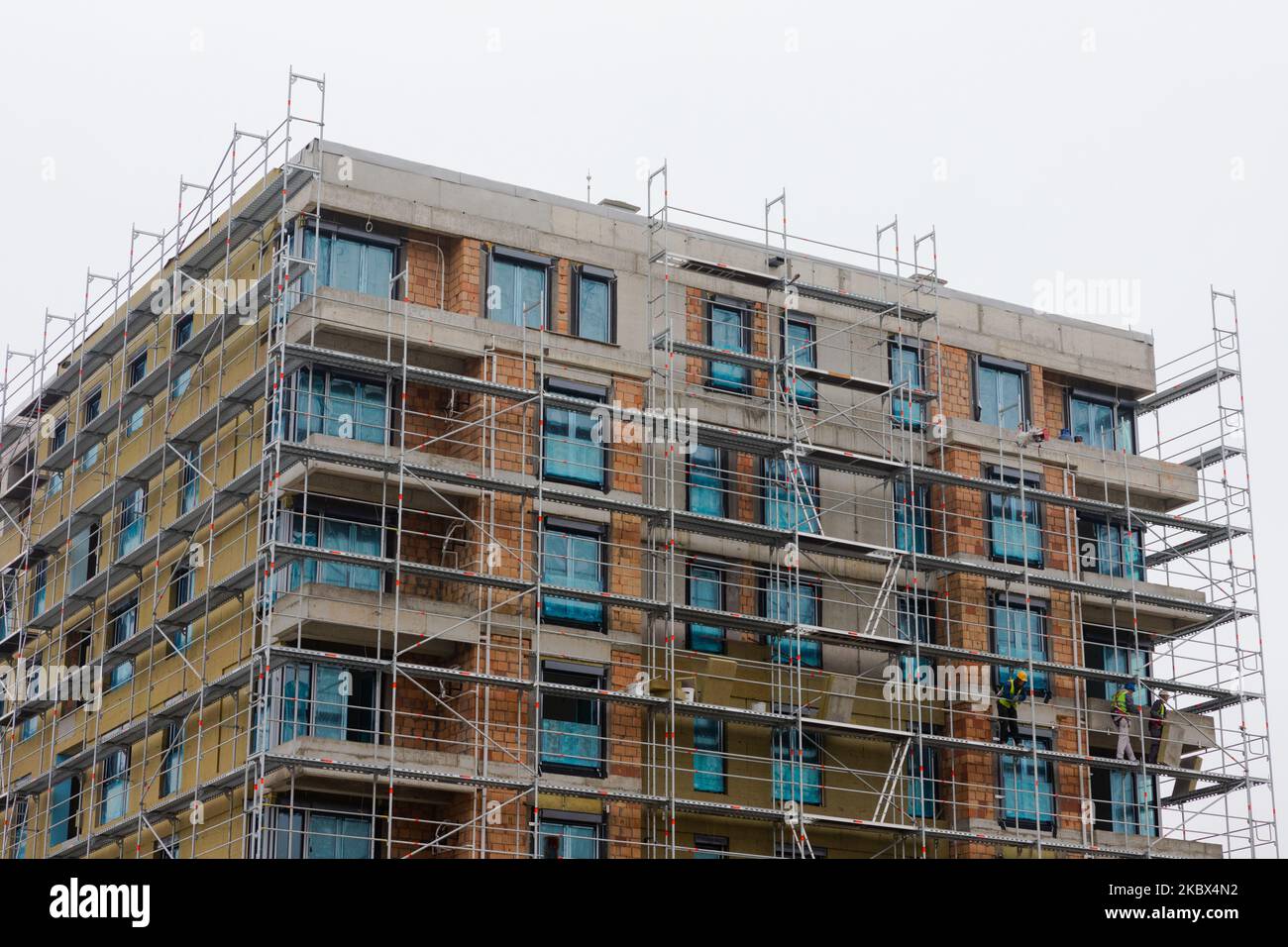 Photo inspiration: Building Apartment Building Placing Rock Wool Insulation On The Walls Photo Inspiration