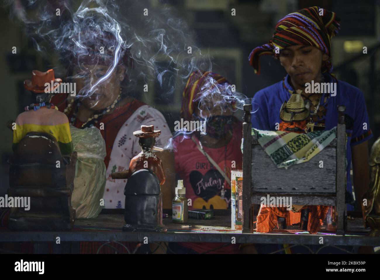 Indigenous people begin their ceremony at the temple of San Simón in San Andrés Itzapa, 50 kilometers west of Guatemala's capital city, on August 14, 2020. Thousands of people believe that the saint who helps people find work, solves family problems and cures illnesses. During the pandemic, the temple was closed to prevent contagion, with a total of 61,428 people infected and 2,341 dead throughout the country. (Photo by Deccio Serrano/NurPhoto) Stock Photo