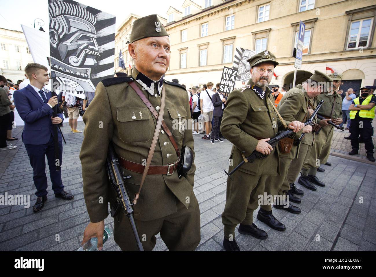 Men dressed in old, Polish army uniforms are seen ahead of a march in Warsaw, Poland on August 15, 2020. The far-right and ultranationalist youth organisation organized a march on Saturday in light of the 100th anniversary of the Battle of Warsaw, the battle that turned the tide on the Bolshevik invasion of Europe. The All Polish Youth also oppose liberal values and oppose non-binary gender people who they see as a threat to Polish culture. (Photo by Jaap Arriens/NurPhoto) Stock Photo